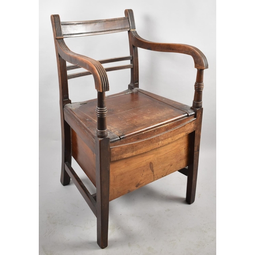 520 - An Edwardian Commode Armchair