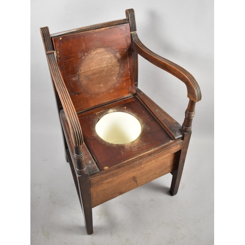 520 - An Edwardian Commode Armchair