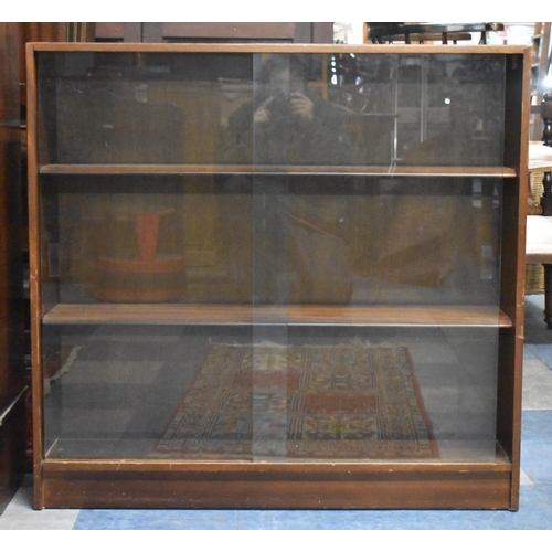 522 - A Mid 20th Century Glazed Three Shelf Bookcase with Sliding Doors, 91cm wide