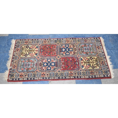 534 - A Patterned Woollen Hearth Rug, 120x64cm