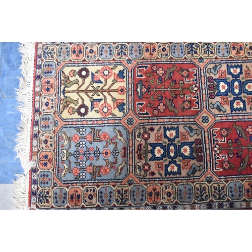 534 - A Patterned Woollen Hearth Rug, 120x64cm