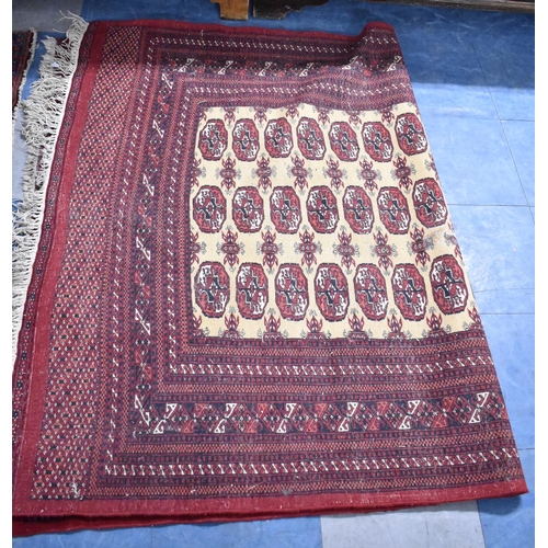 552 - A Patterned Rug on Red Ground, 195x133cm