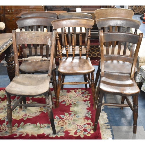 553 - A Harlequin Set of Eight Kitchen Chairs