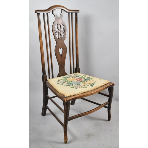 554 - An Edwardian Tapestry Seated Ladies Nursing Chair with Pierced Wheel Back