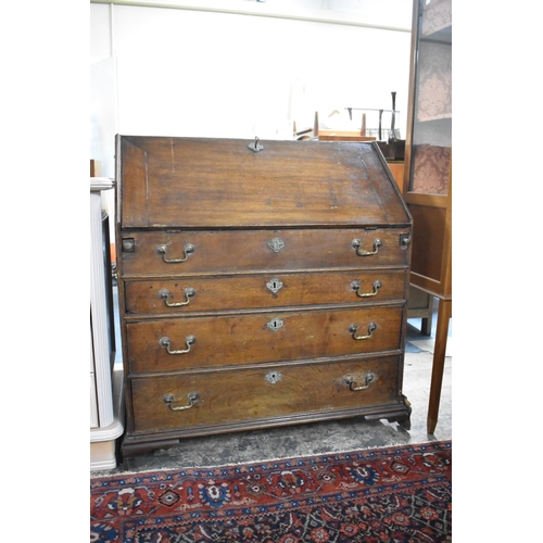 557 - A 19th Century Oak Fall Front Bureau with Fitted Interior Having Nine Drawers, Eleven Pigeon Holes a... 