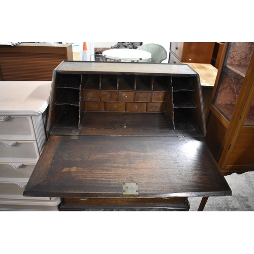 557 - A 19th Century Oak Fall Front Bureau with Fitted Interior Having Nine Drawers, Eleven Pigeon Holes a... 