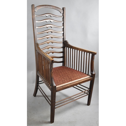 561 - An Edwardian Ladder Back Armchair with Spindle Supports