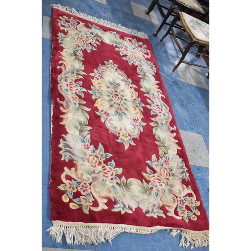 568 - A Chinese Woollen Rug, 182x90cm