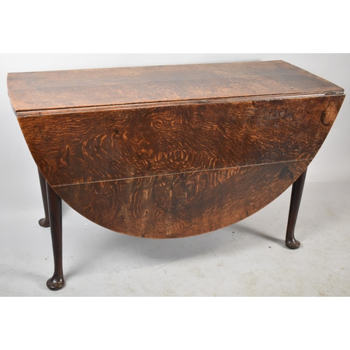 623 - A 19th Century Oak Drop Leaf Oval Topped Dining Table on Pad Feet, 121cm wide