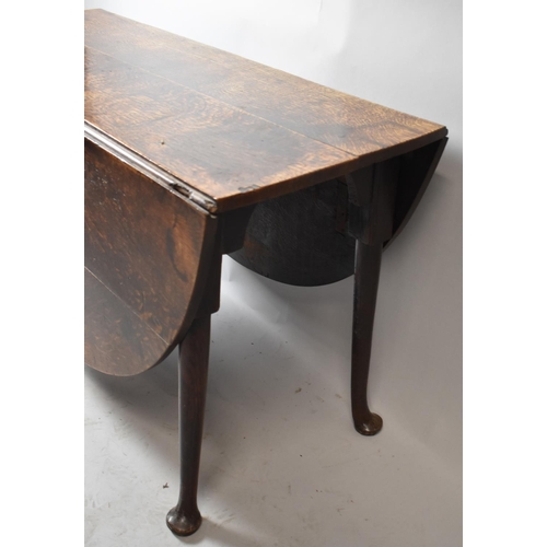 623 - A 19th Century Oak Drop Leaf Oval Topped Dining Table on Pad Feet, 121cm wide