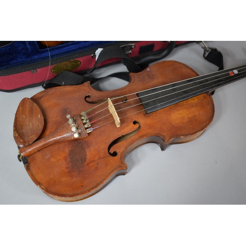 101 - An Early 20th Century Child's Spruce Topped Violin together with a Cased Smaller Example