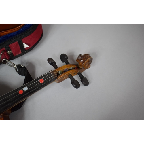 101 - An Early 20th Century Child's Spruce Topped Violin together with a Cased Smaller Example