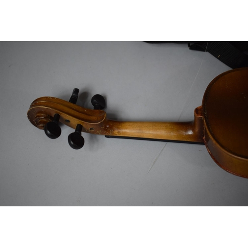 101 - An Early 20th Century Child's Spruce Topped Violin together with a Cased Smaller Example