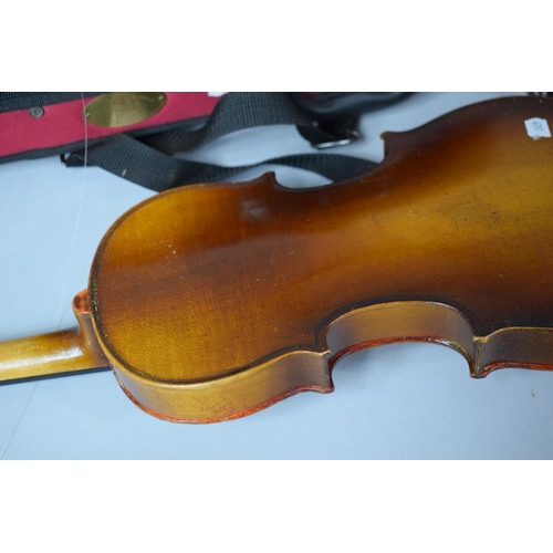 101 - An Early 20th Century Child's Spruce Topped Violin together with a Cased Smaller Example