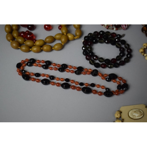 127 - A Collection of Various Necklaces to Include Amber and Amber Style Beads, Glass, Yellow Metal and Ea... 