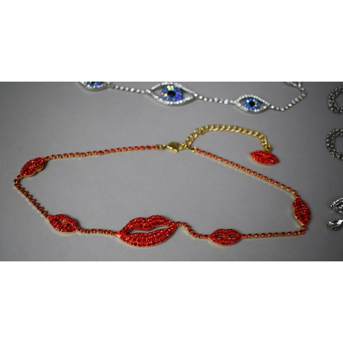 151 - Three Pieces of Butler and Wilson Costume Jewellery to include Lips Necklace and Two Greek Eye Neckl... 