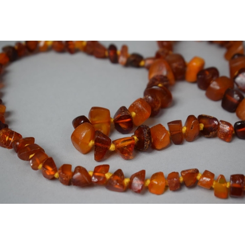 303 - An Amber Chip Necklace, 68.3gms.