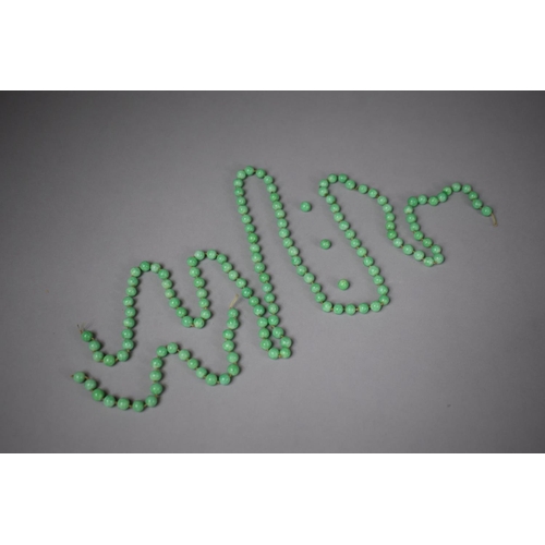 304 - A Long String of Chinese Apple Green Jade Ovoid Beads, (In Need of Restringing) Each Bead Approx 5x8... 