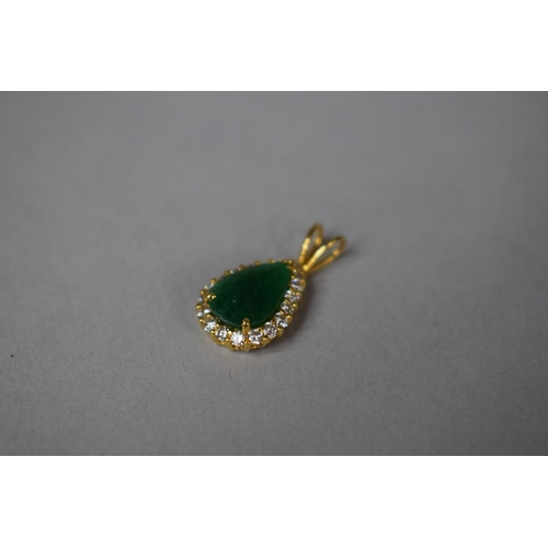 318 - A Gold, Diamond and Emerald Pendant of Tear Shape. 2.1gms