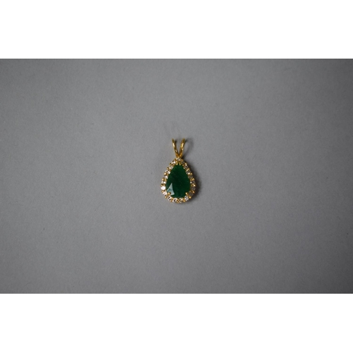 318 - A Gold, Diamond and Emerald Pendant of Tear Shape. 2.1gms