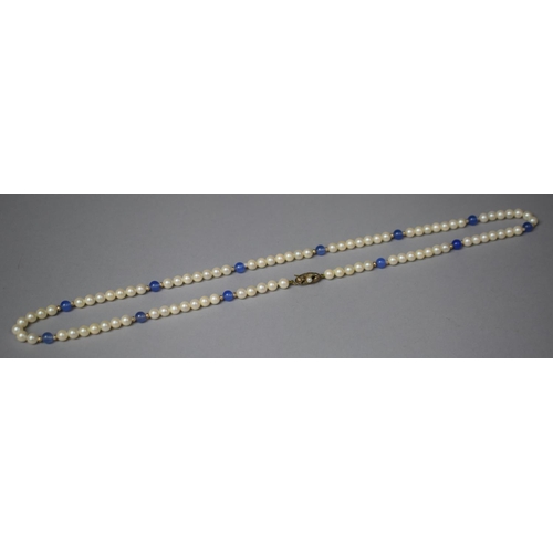 325 - A String of Pearls and Blue Glass Beads having Silver Clasp Stamped 935