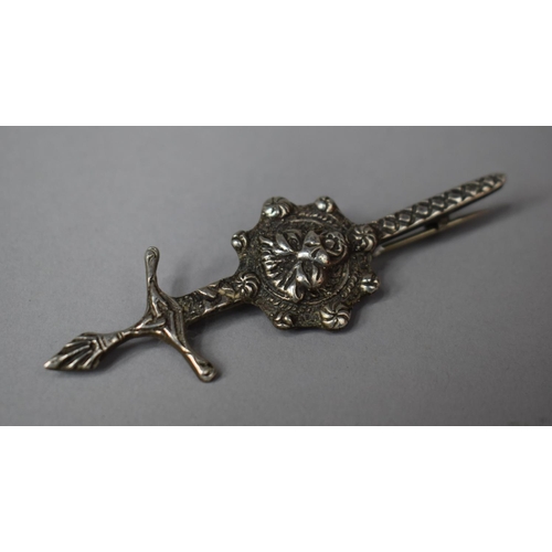 327 - A Silver Brooch with Silver Sword and Lion Head, 8cms Wide