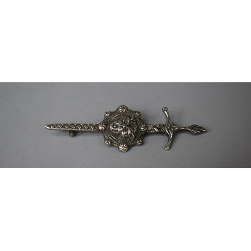 327 - A Silver Brooch with Silver Sword and Lion Head, 8cms Wide