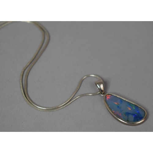 329 - A Pretty Ammolite or Opal Pendant on Silver Chain, Pendant 2.5x1.4cms