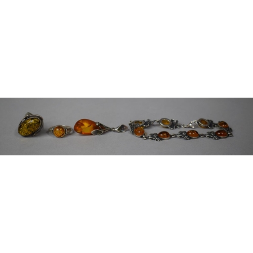 339 - Four Pieces of Silver and White Metal Mounted Amber Jewellery having Botanic Inspired Mounts