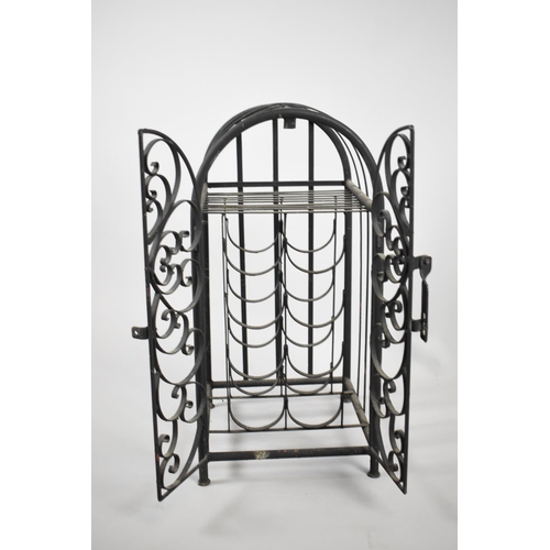 357 - A Small Wrought Iron Eight Bottle Wine Rack in Locking Cage, 67cms Tall x30cms Wide