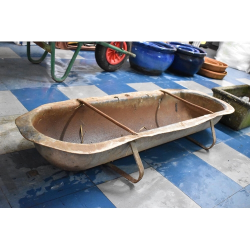 359 - An Early 20th Century Cast Metal Feeding Trough having Strapwork Supports, 130cms Wide by 42cms Deep... 