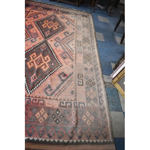 438 - A Turkish Kilim Carpet with Two Central Lozenge Shaped Medallion Design, 189x313cms, worn