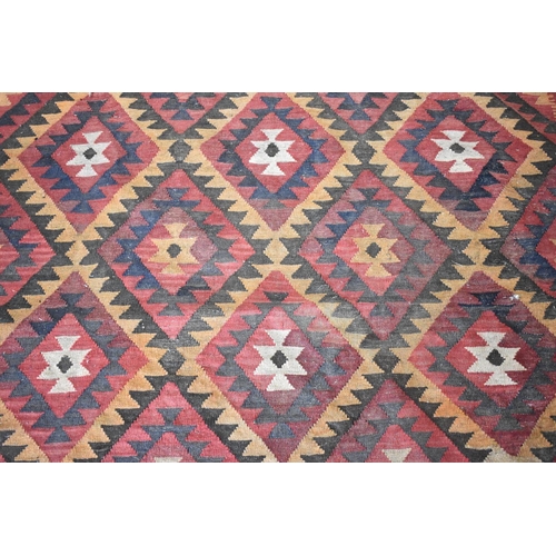 439 - A Turkish Carpet of Kilim Design with Repeating Geometric Lozenge on Red Ground, 300 x 320cms (AF)