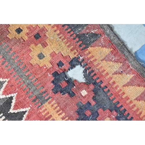 439 - A Turkish Carpet of Kilim Design with Repeating Geometric Lozenge on Red Ground, 300 x 320cms (AF)