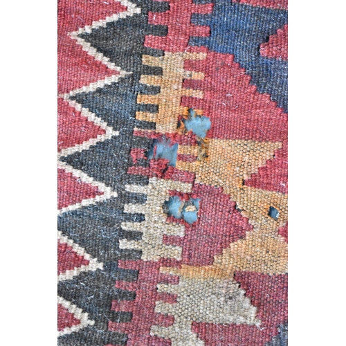 439 - A Turkish Carpet of Kilim Design with Repeating Geometric Lozenge on Red Ground, 300 x 320cms (AF)