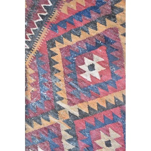 439 - A Turkish Carpet of Kilim Design with Repeating Geometric Lozenge on Red Ground, 300 x 320cms (AF)