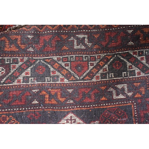 465 - A Persian Pattern Rug on Red Ground, 313x211cm