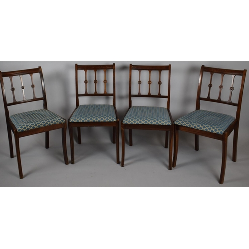 471 - A Set of Four Dining Chairs with Spindles Rosset Stylised Backs and Upholstered Pad Seats