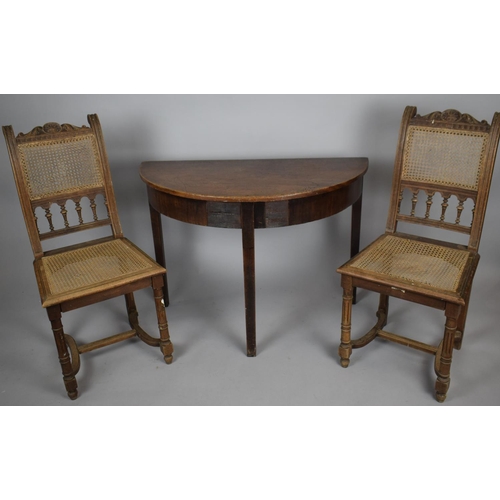 477 - A Demilune Side Table with Loss to Veneer Together with Two Cane Seated Chairs with Carved Tops and ... 