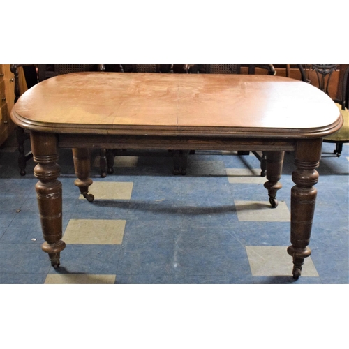 492 - A Late Victorian Mahogany Dining Table on Turned Bulbous Tapering Supports, Extending Wind Out Mecha... 