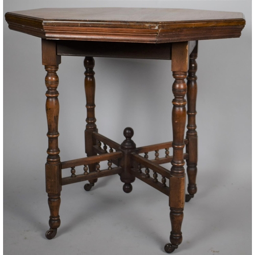 498 - An Edwardian Mahogany Hexagonal Topped Table on Turned Caster Supports and Spindled Stretcher, 45cm ... 