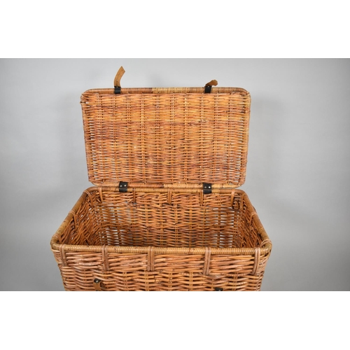 506 - A Large Wicker Hamper with Leather Straps and Two Carrying Handles to Sides