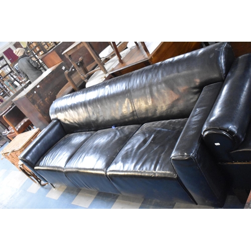 508 - A Mid/Late 20th Century Black Leather Upholstered and Chrome Supported Three Seater Settee