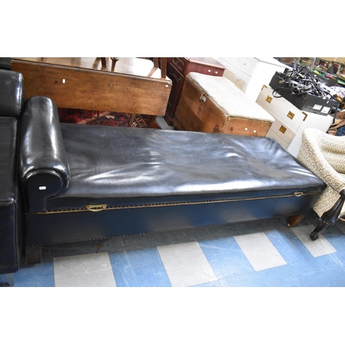 509 - A Leather Upholstered Doctors Couch with Brass Handled Hinged Top Revealing Inner Store Supported on... 