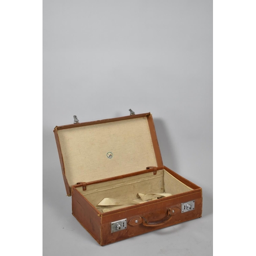 68 - A Leather Suitcase Retailed by The Army & Navy Stores LTD Monogrammed J.R.K, 55.5cms Wide