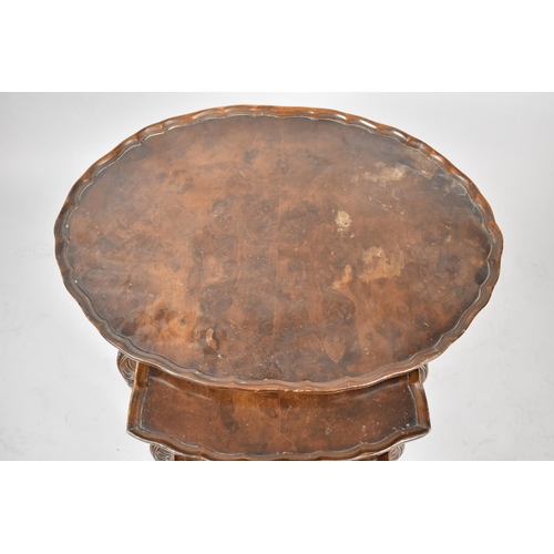 115 - A Nest of Three Oval Walnut Tables, The Largest 60cm wide