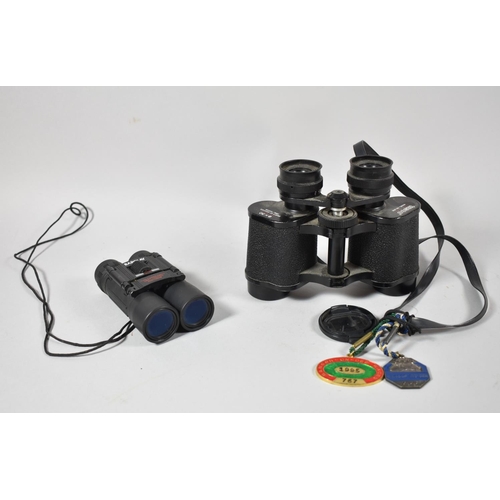 125 - A Pair of Tasco 8x30 Binocular and a Pair of Barclay Folding Pocket Binoculars