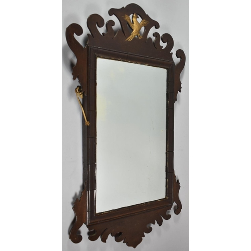 124 - A 19th Century Mahogany Copy of a Georgian Fret Cut Wall Mirror with Gilt Ho-ho Bird, 70cm high