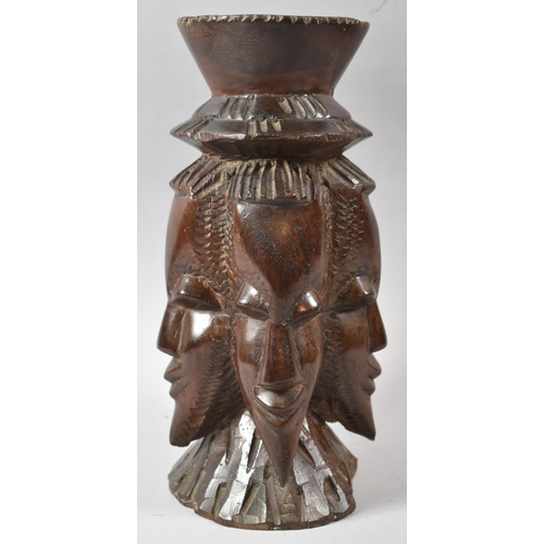 108 - A Heavy Carved African Smokers Stand in the Form of Four Tribal Masks, 33cm high