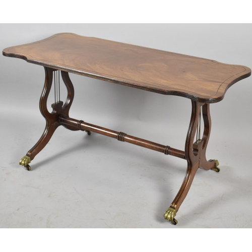 118 - A Mid 20th Century Mahogany Coffee Table on Lyre Supports with Brass Claw Feet, 88cm Long